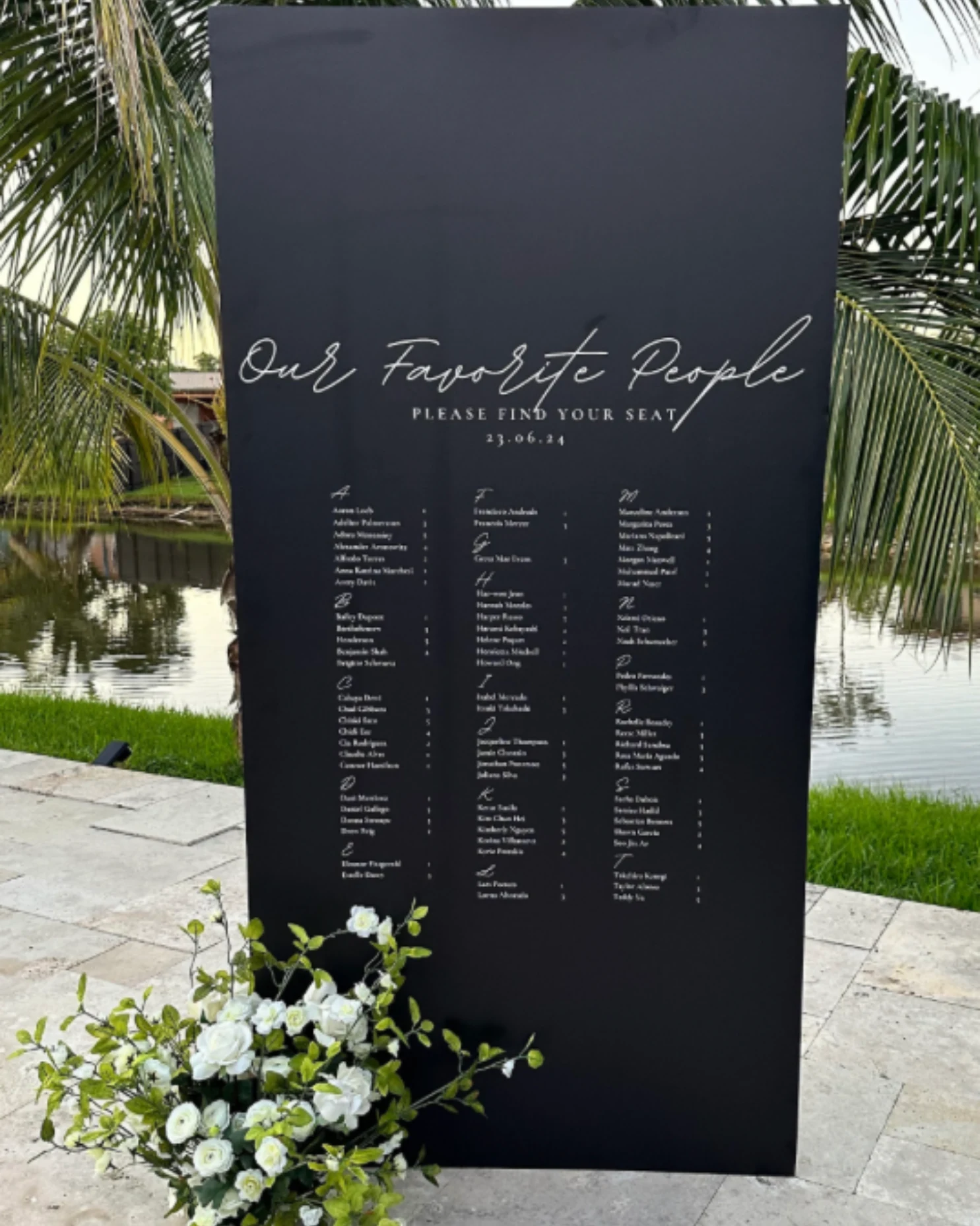 Black guest-list seating chart with a personalized heading.